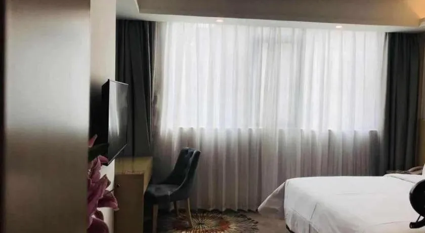 Bed in Vienna Hotel Guangzhou Huadu Financial Center Sunac Amusement Park