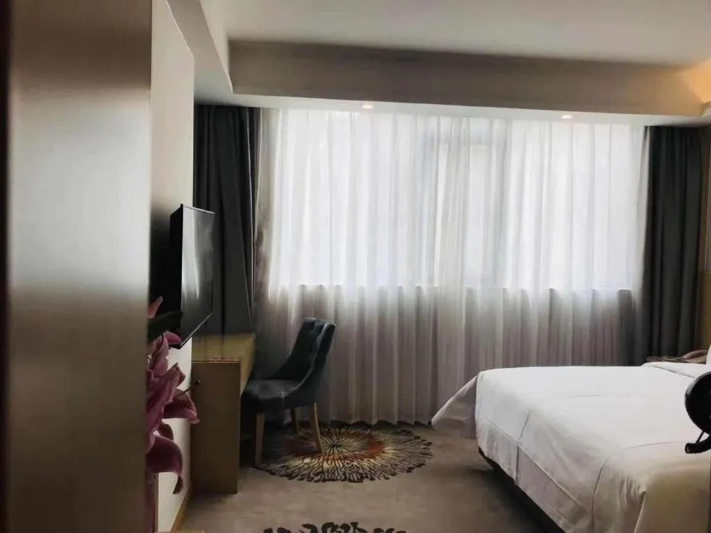 Bed in Vienna Hotel Guangzhou Huadu Financial Center Sunac Amusement Park
