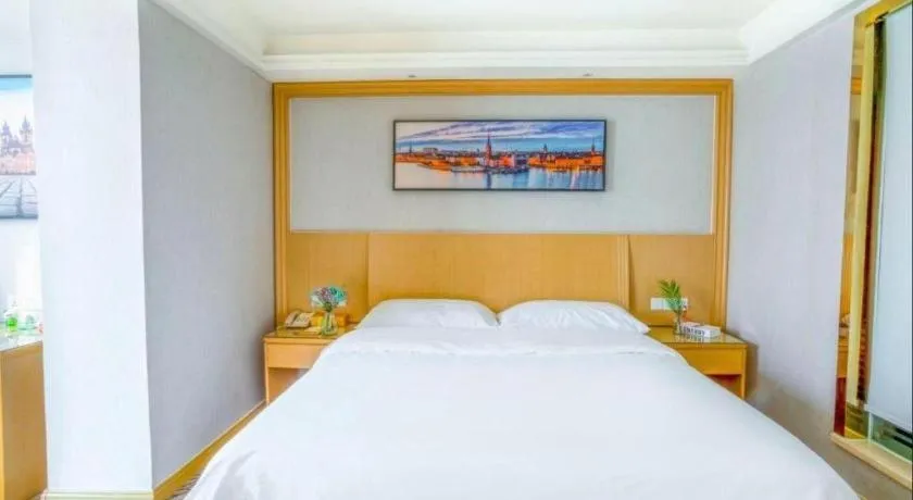 Bed in Vienna Hotel Guangzhou Huadu Financial Center Sunac Amusement Park