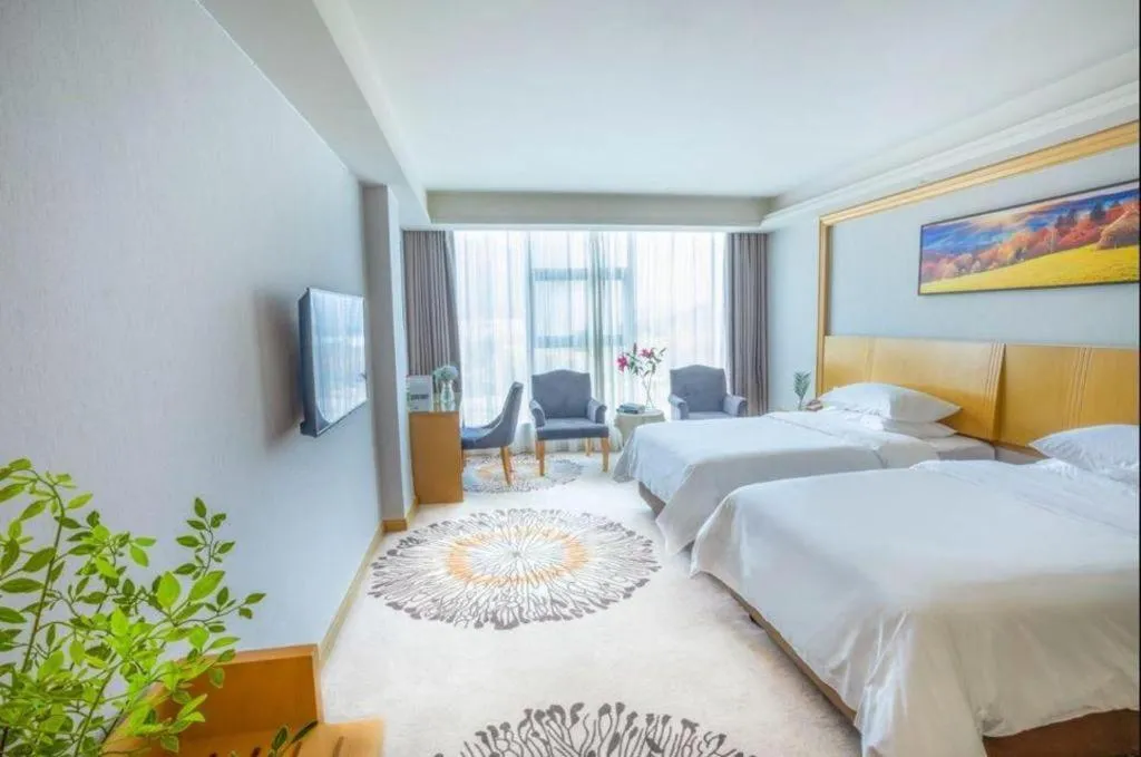 Bed in Vienna Hotel Guangzhou Huadu Financial Center Sunac Amusement Park