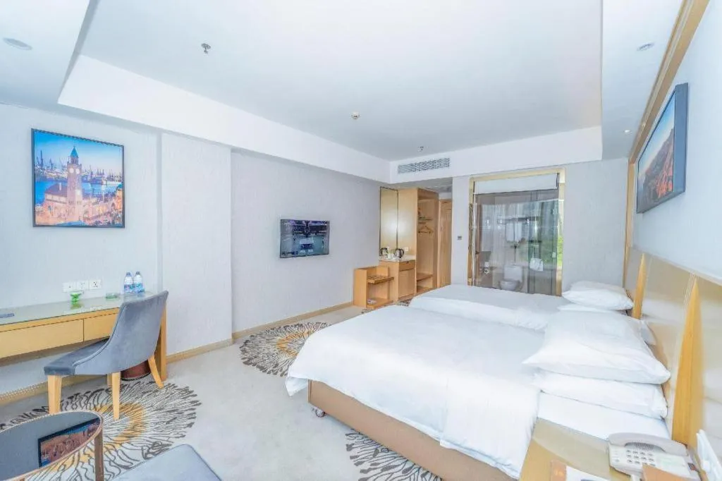 Bed in Vienna Hotel Guangzhou Huadu Financial Center Sunac Amusement Park