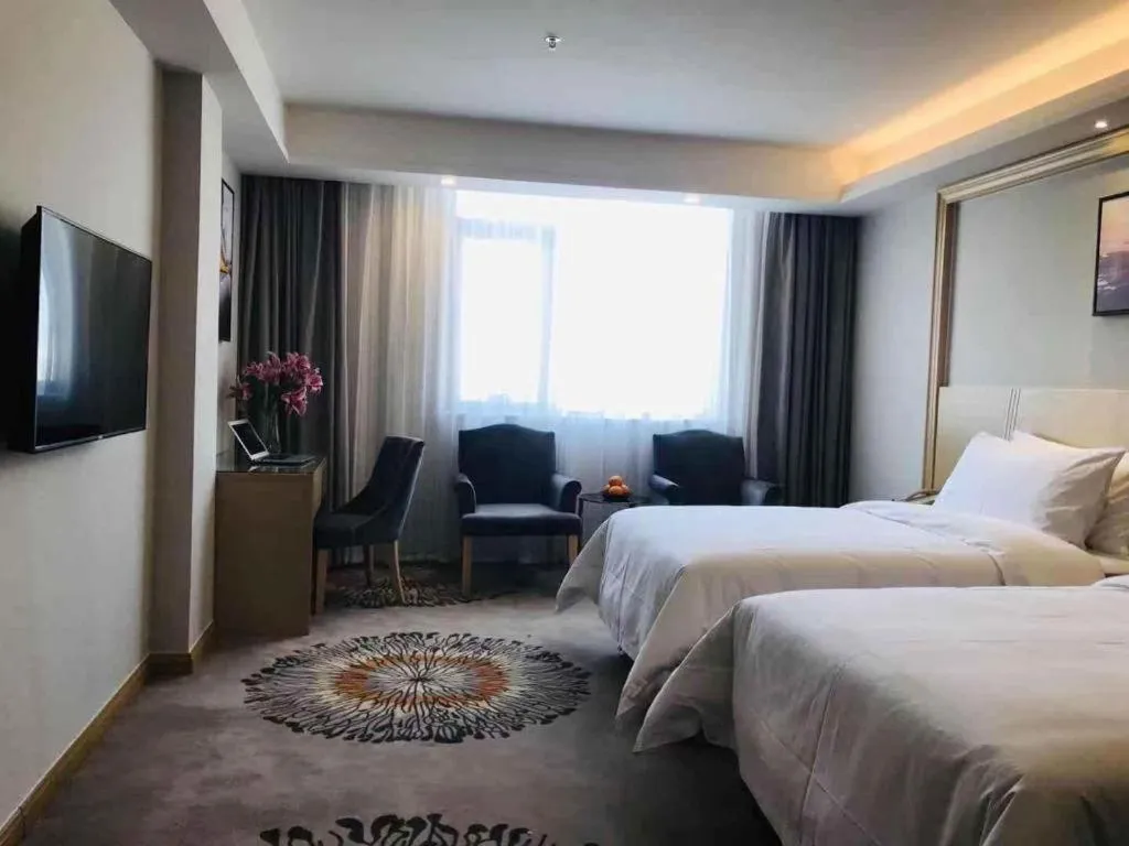 Bed in Vienna Hotel Guangzhou Huadu Financial Center Sunac Amusement Park