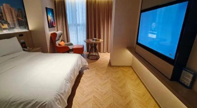 Bed in Vienna Hotel Guangzhou Huadu Financial Center Sunac Amusement Park