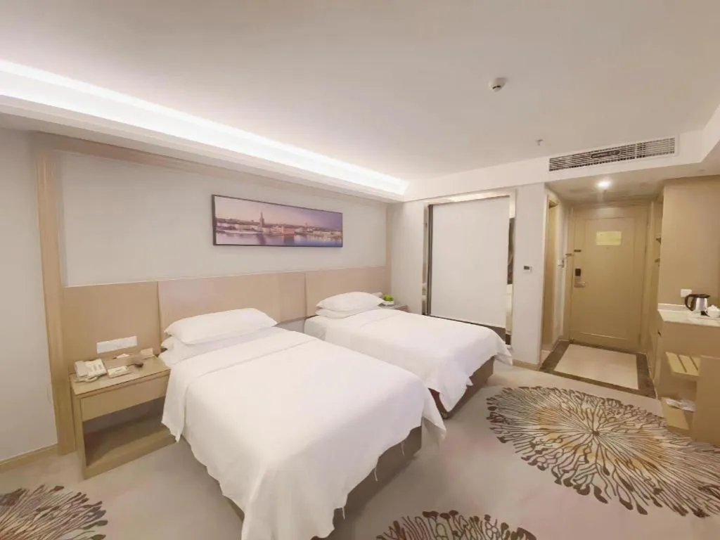 Bed in Vienna Hotel Guangzhou Huadu Financial Center Sunac Amusement Park