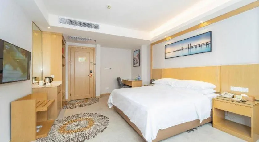 Bed in Vienna Hotel Guangzhou Huadu Financial Center Sunac Amusement Park