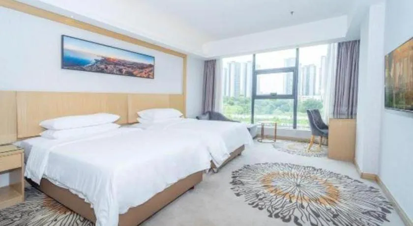 Bed in Vienna Hotel Guangzhou Huadu Financial Center Sunac Amusement Park