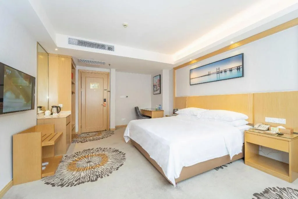 Bed in Vienna Hotel Guangzhou Huadu Financial Center Sunac Amusement Park