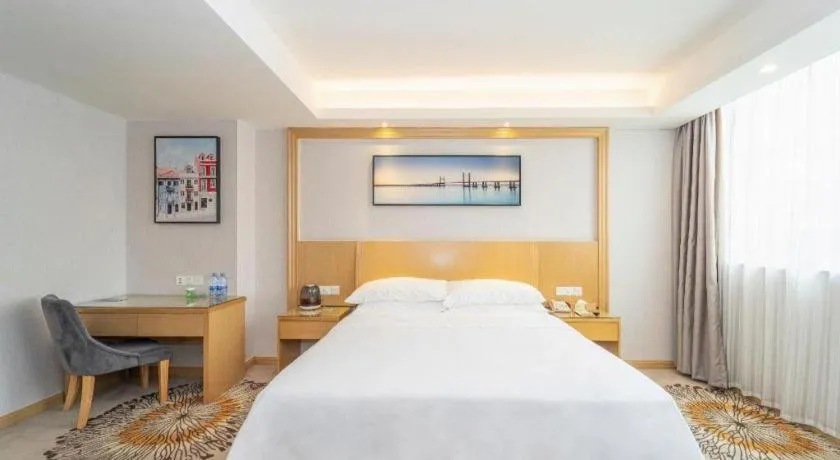Bed in Vienna Hotel Guangzhou Huadu Financial Center Sunac Amusement Park