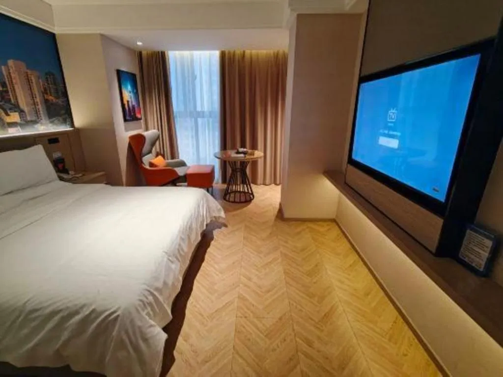 Bed in Vienna Hotel Guangzhou Huadu Financial Center Sunac Amusement Park