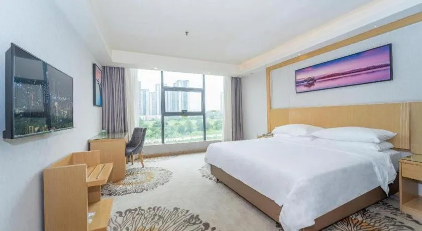 Bed in Vienna Hotel Guangzhou Huadu Financial Center Sunac Amusement Park