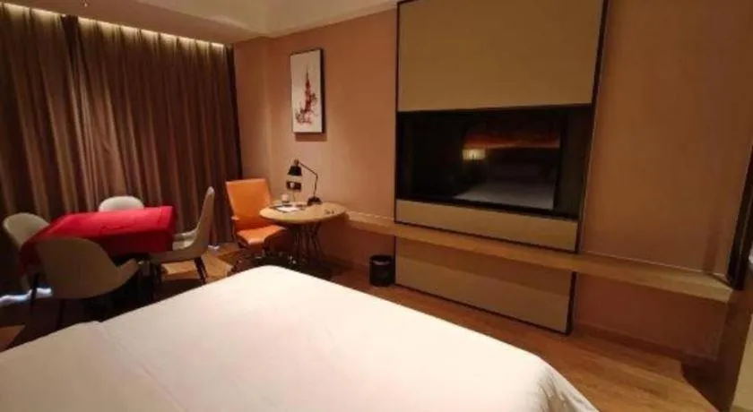 Bed in Vienna Hotel Guangzhou Huadu Financial Center Sunac Amusement Park