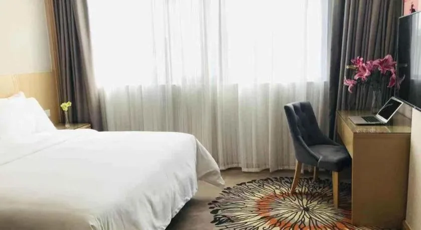 Bed in Vienna Hotel Guangzhou Huadu Financial Center Sunac Amusement Park