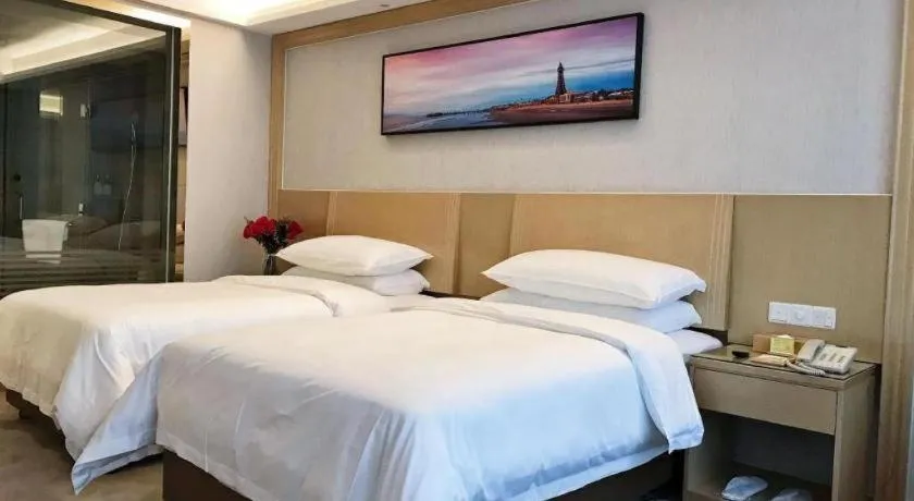 Bed in Vienna Hotel Guangzhou Huadu Financial Center Sunac Amusement Park