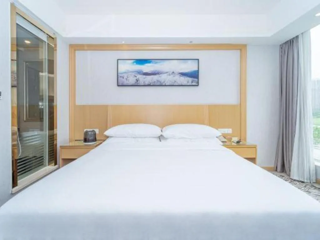 Bed in Vienna Hotel Guangzhou Huadu Financial Center Sunac Amusement Park