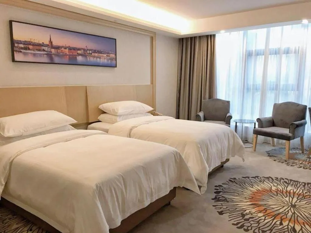 Bed in Vienna Hotel Guangzhou Huadu Financial Center Sunac Amusement Park