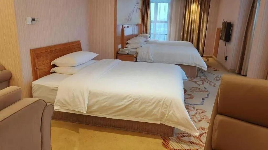 Bed in Vienna Hotel Jiangsu Kunshan Changjiang North Road Fenghuangcheng