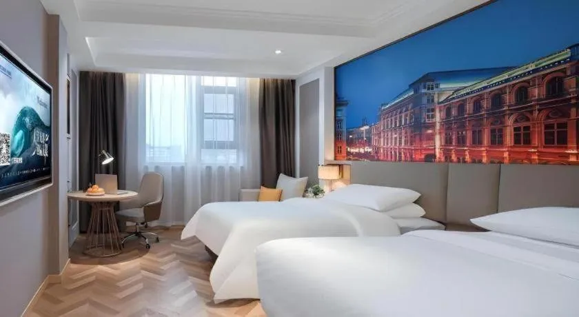 Bed in Vienna Hotel Jiangsu Dongtai Wanghai West Road