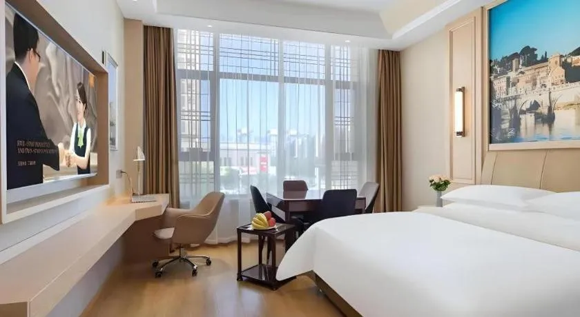 Bed in Vienna Hotel Jiangsu Dongtai Wanghai West Road