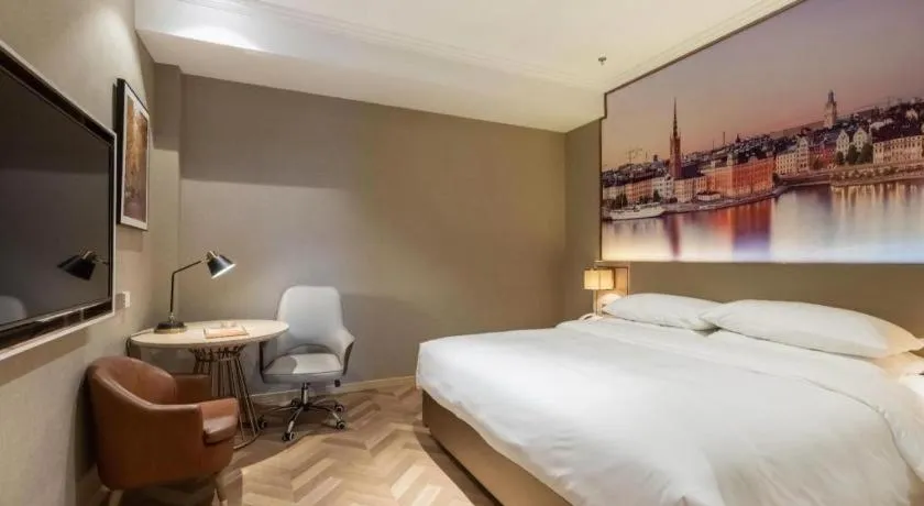 Bed in Vienna Hotel Jiangsu Dongtai Wanghai West Road