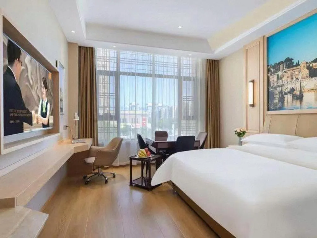 Bed in Vienna Hotel Jiangsu Dongtai Wanghai West Road