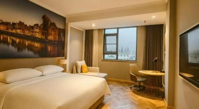 Bed in Vienna Hotel Jiangsu Dongtai Wanghai West Road