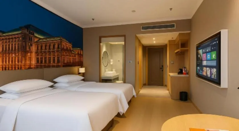 Bed in Vienna Hotel Jiangsu Dongtai Wanghai West Road