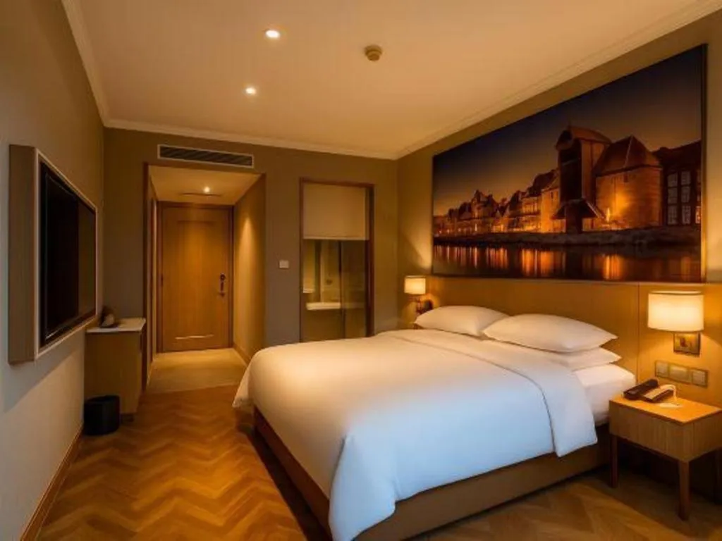 Bed in Vienna Hotel Jiangsu Dongtai Wanghai West Road