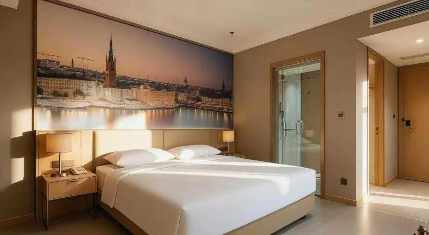 Bed in Vienna Hotel Jiangsu Dongtai Wanghai West Road