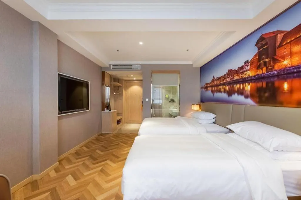 Bed in Vienna Hotel Jiangsu Dongtai Wanghai West Road