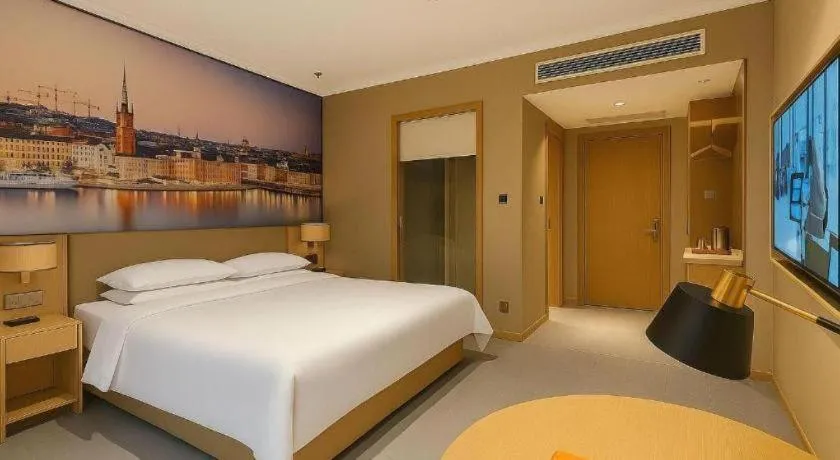 Bed in Vienna Hotel Jiangsu Dongtai Wanghai West Road