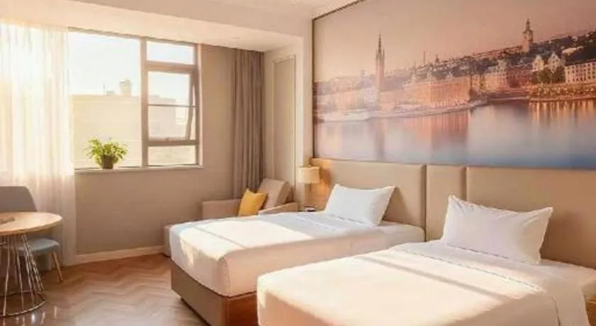 Bed in Vienna Hotel Jiangsu Dongtai Wanghai West Road
