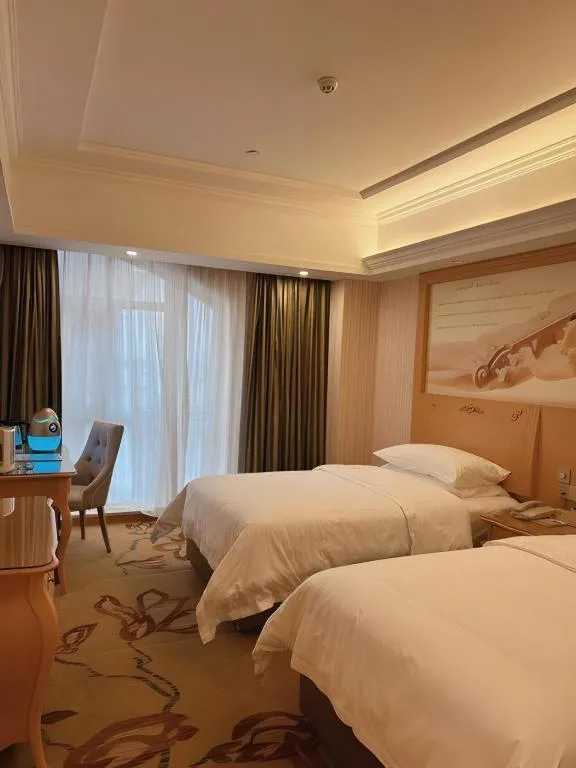 Bed in Vienna Hotel Guangdong Zhongshan Caihong Avenue