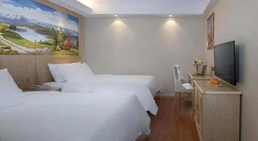 Bed in Vienna Hotel Shenzhen Window of the World Qiaochengdong Metro Station
