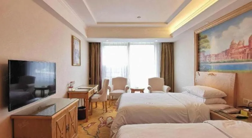 Bed in Vienna Hotel Shenzhen Window of the World Qiaochengdong Metro Station