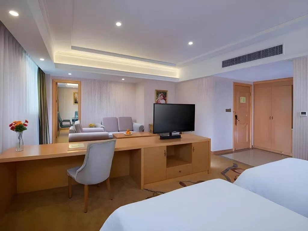 Bed in Vienna Hotel Guangdong Meizhou Fengshun