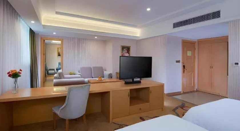 Bed in Vienna Hotel Guangdong Meizhou Fengshun