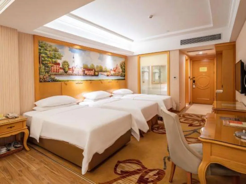 Bed in Vienna Hotel Guangdong Meizhou Fengshun