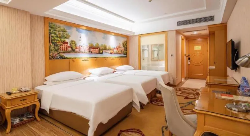 Bed in Vienna Hotel Guangdong Meizhou Fengshun