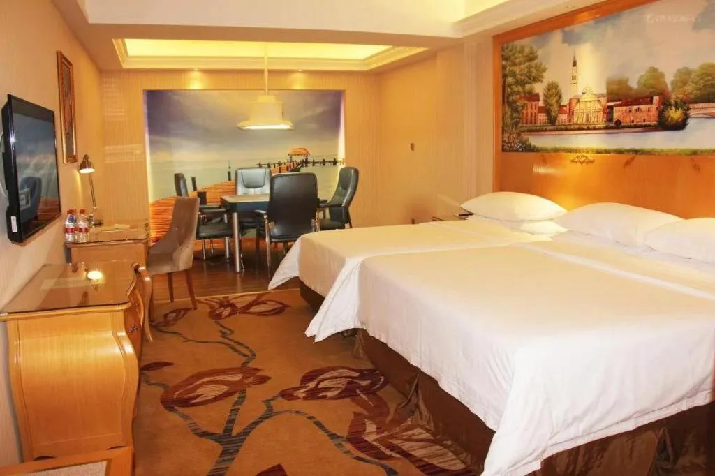 Bed in Vienna Hotel Guangdong Meizhou Fengshun
