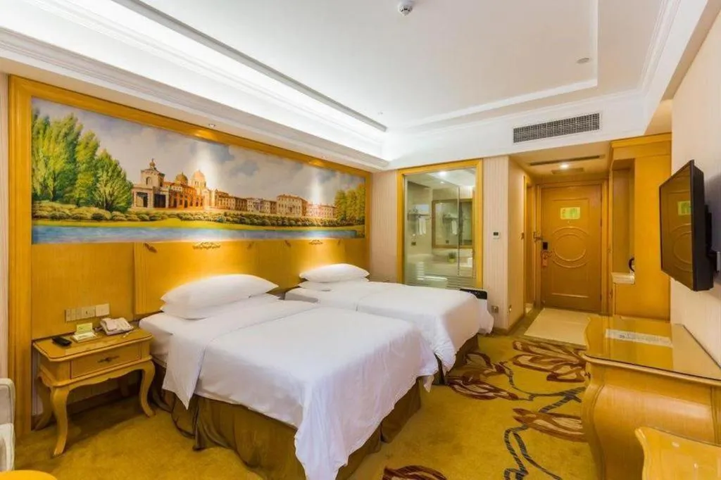 Bed in Vienna Hotel Guangdong Meizhou Fengshun