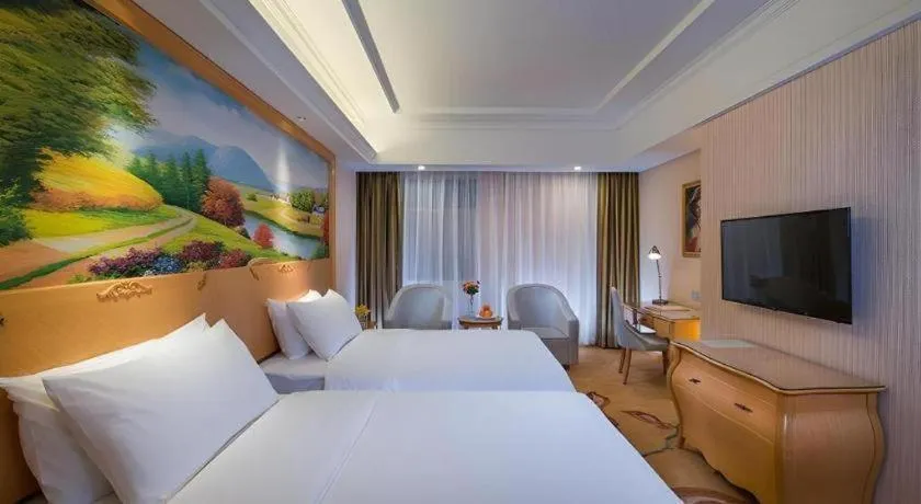 Bed in Vienna Hotel Guangdong Meizhou Fengshun