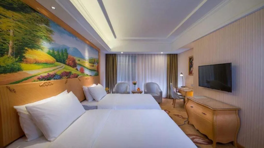 Bed in Vienna Hotel Guangdong Meizhou Fengshun