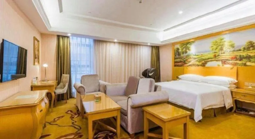 Bed in Vienna Hotel Guangdong Meizhou Fengshun