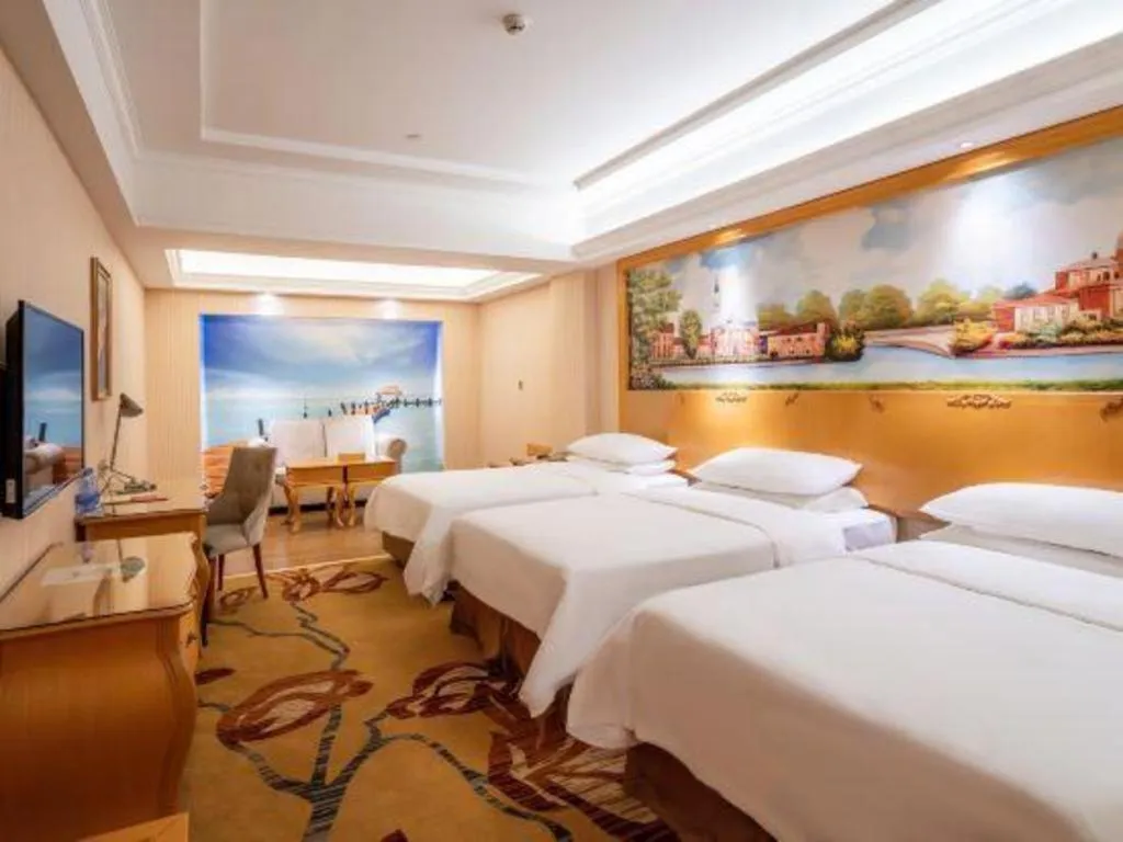 Bed in Vienna Hotel Guangdong Meizhou Fengshun