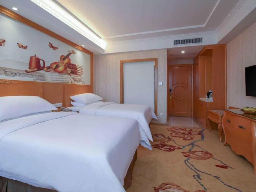 Bed in Vienna Hotel Guangdong Huiyang Qiuchang Yingbin Road