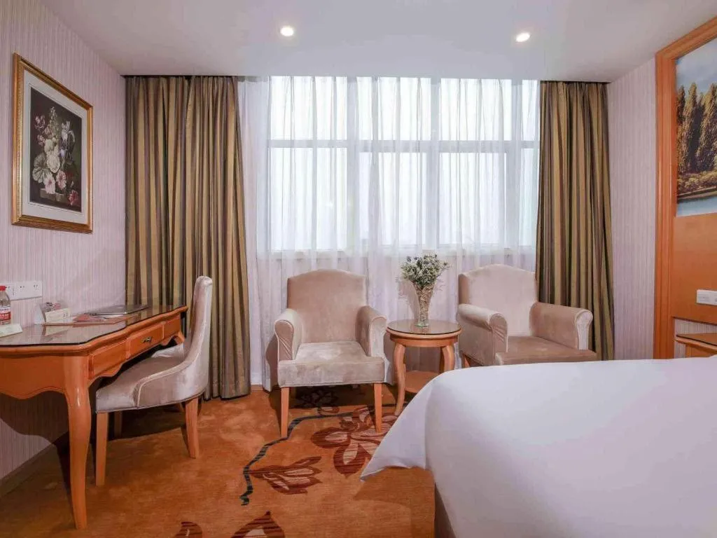 Bed in Vienna Hotel Guangdong Huiyang Qiuchang Yingbin Road