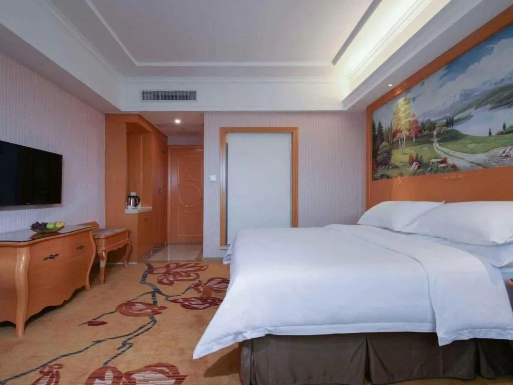 Bed in Vienna Hotel Guangdong Huiyang Qiuchang Yingbin Road