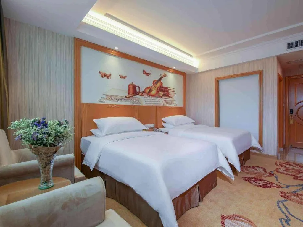 Bed in Vienna Hotel Guangdong Huiyang Qiuchang Yingbin Road