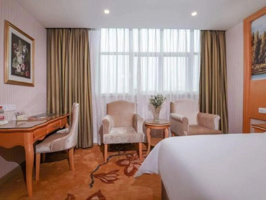 Bed in Vienna Hotel Guangdong Huiyang Qiuchang Yingbin Road