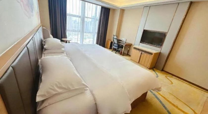 Bed in Venus Royal Hotel Nanning East High-Speed Railway Station